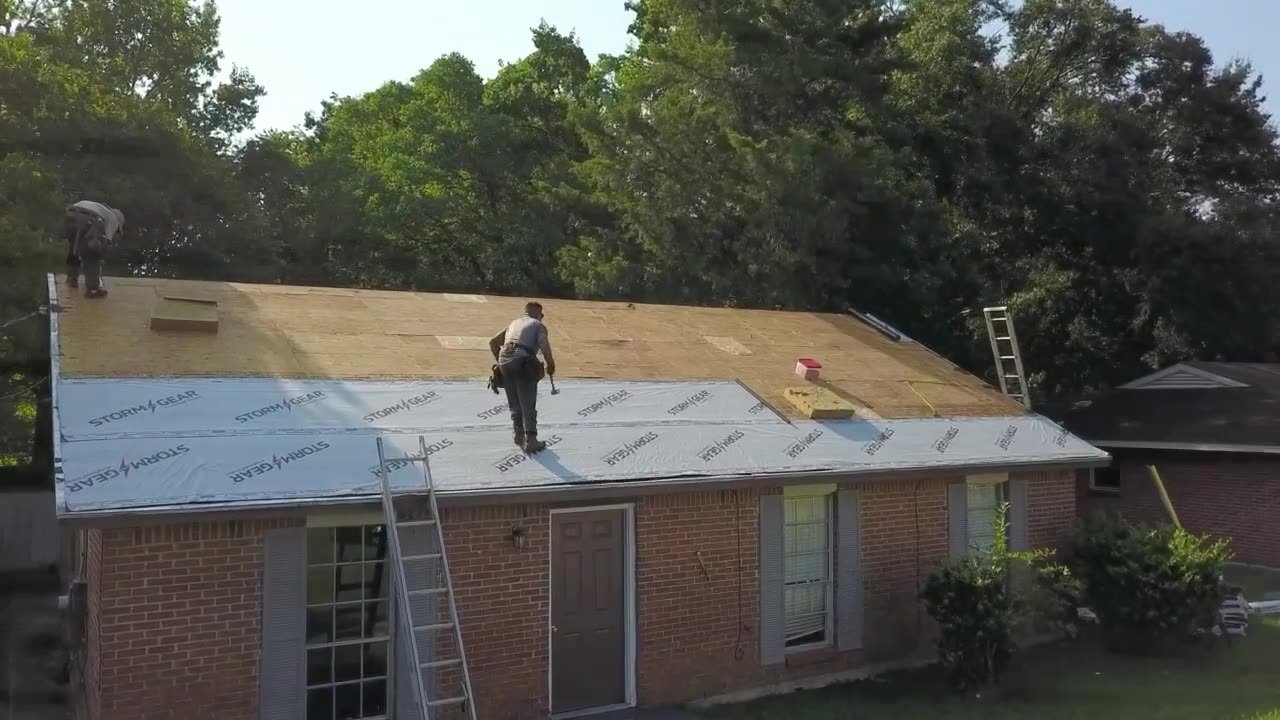 Roof Wrx crew replacing a roof on a brick ranch home